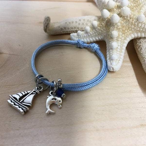 #118 Bracelet ajustable bleu avec voilier et dauphin